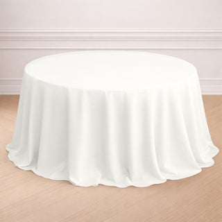 White round tablecloth draped elegantly over a circular table.