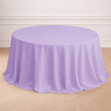 Round lavender tablecloth on a wooden floor.