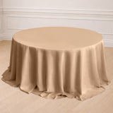 Round beige tablecloth draped elegantly over a table.