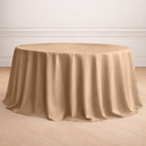 Beige round tablecloth draping elegantly on a round table.