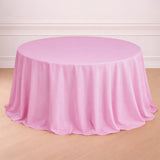 Round pink tablecloth draped elegantly over a table.