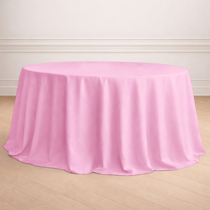 Pink round tablecloth draped elegantly over a table.