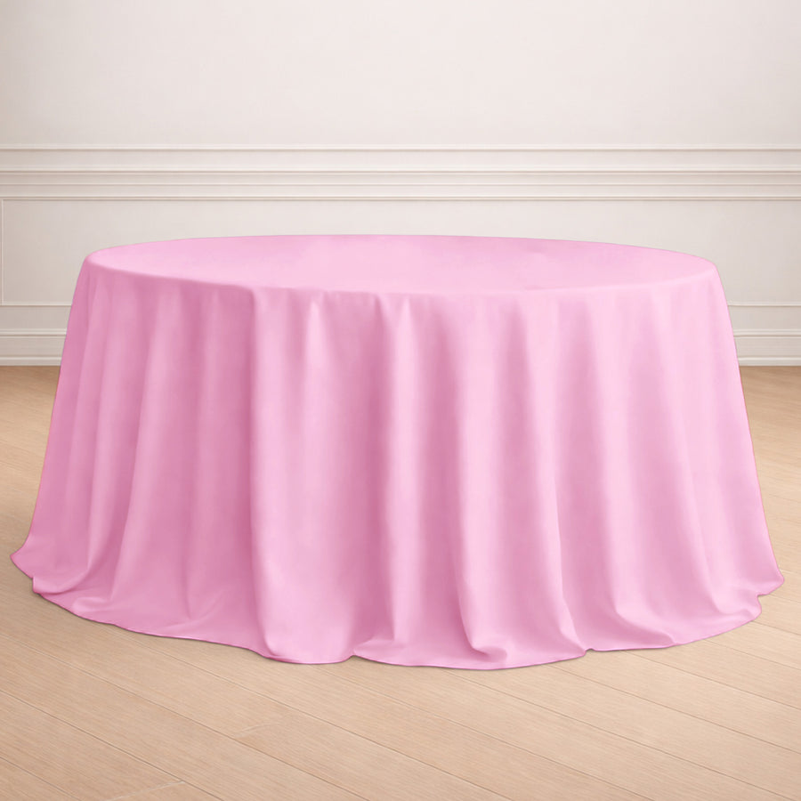 Pink round tablecloth draped elegantly over a table.