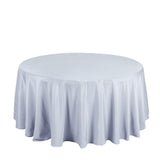 Round table covered with a light gray tablecloth