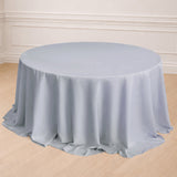 Round gray tablecloth draped over a table in a light, staged setting.