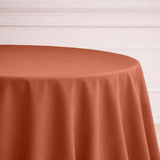 Rust-colored round tablecloth draped elegantly over a table.