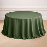 Round olive green tablecloth draped elegantly over a table.