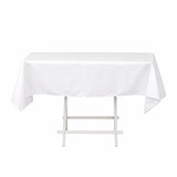 White rectangular table with white tablecloth on folding stand