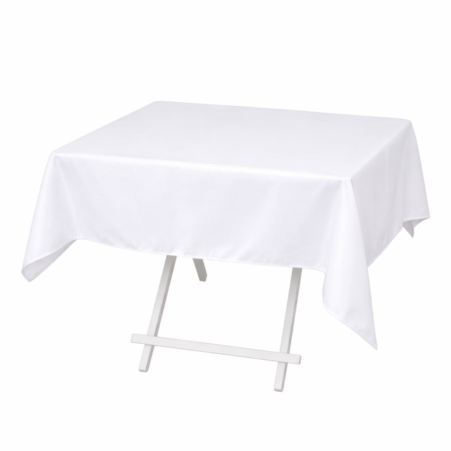 White rectangular tablecloth on folding table stand