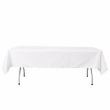 White rectangular banquet table with tablecloth on folding legs