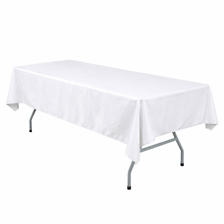 White rectangular table with fitted tablecloth on folding legs