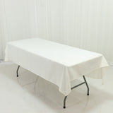 White table with a plain tablecloth on a folding frame
