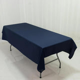 Navy blue tablecloth draped over a folding table