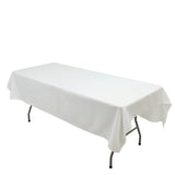 White table with a cloth cover on folding legs
