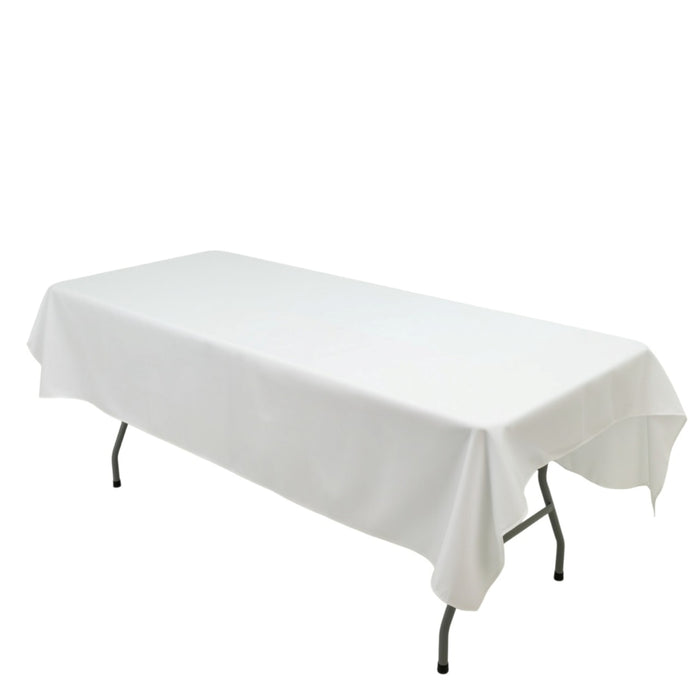 White table with a cloth cover on folding legs