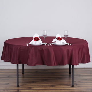 Elevate Your Event with the 70" Round Burgundy Seamless Polyester Linen Tablecloth