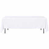 White rectangular table with a draped tablecloth