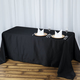 Elevate Your Event with the 90"x132" Black Seamless Premium Polyester Rectangular Tablecloth
