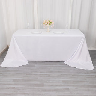 Experience Elegance with the 90"x156" White Seamless Polyester Round Corner Tablecloth