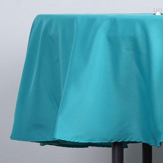 Enhance Your Event Decor with the 90" Turquoise Seamless Polyester Round Tablecloth