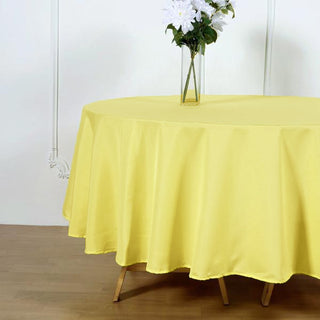 Add a Pop of Color with the 90" Yellow Seamless Polyester Round Tablecloth