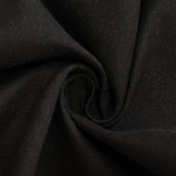 Elegant black tablecloth with white plate and silver cutlery set for dining #whtbkgd