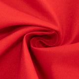 Red tablecloth with a white plate and silver utensils on a dining table #whtbkgd