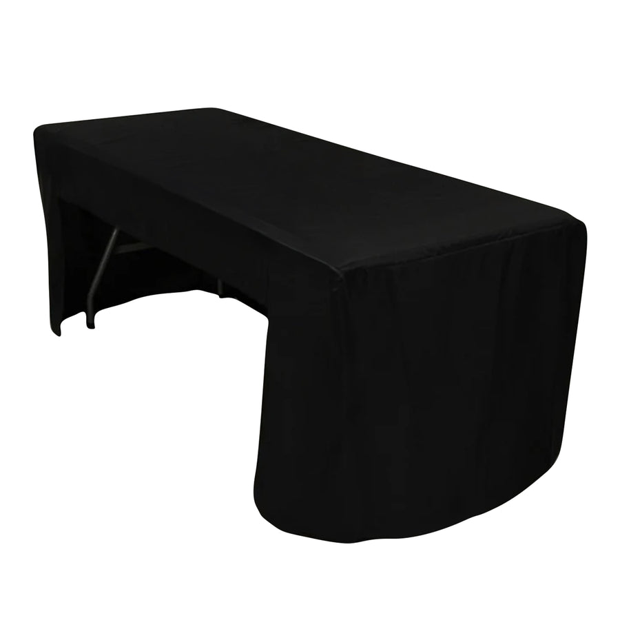 Black tablecloth draped over a folding table for events and gatherings.