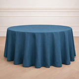 Round blue tablecloth displayed on a wooden surface.