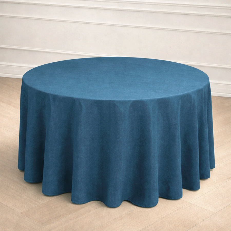Round teal tablecloth draped elegantly over a circular table.