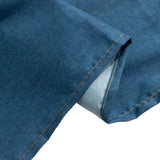 Blue denim fabric with contrasting yellow stitching detail.