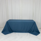 Blue tablecloth on a table in a studio setting