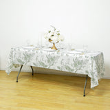 Floral tablecloth set on a dining table with elegant decor and tableware.