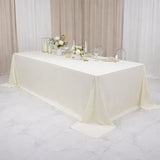 Elegant cream tablecloth on a beautifully set dining table.
