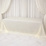 Cream tablecloth draped elegantly over a table in a studio setting.
