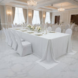Elegant banquet table set for a formal event with floral centerpiece.