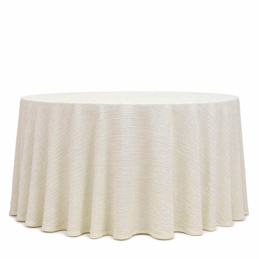 Elegant ivory round table with textured draped tablecloth on white background
