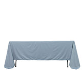 Blue tablecloth draped over a table, showcasing smooth fabric texture