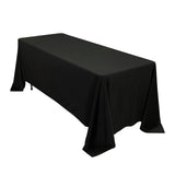 Black tablecloth draped over a rectangular table for events or dining.