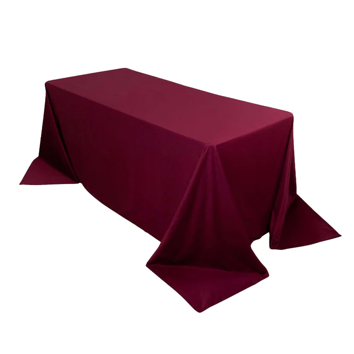 Burgundy tablecloth draped over a rectangular table