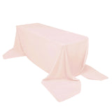 Pink tablecloth draped elegantly over a rectangular table