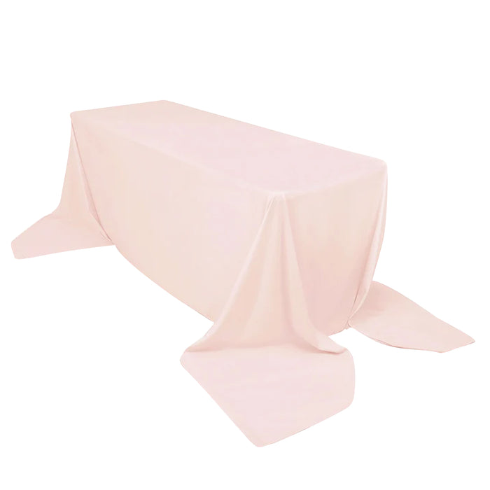 Pink tablecloth draped elegantly over a rectangular table