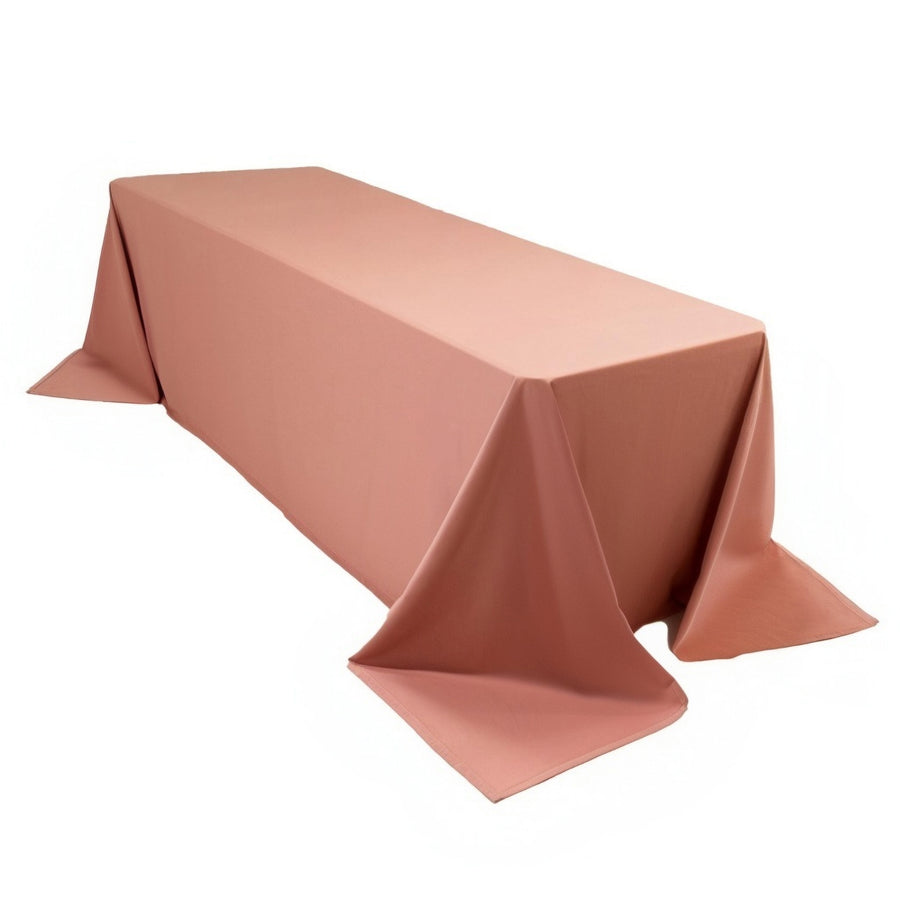 Rectangular table covered with a soft pink tablecloth