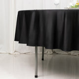 Black tablecloth draping elegantly over a table with a glossy surface.