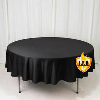 Round black tablecloth on a table with logo