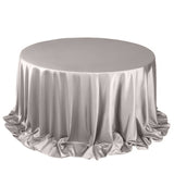 Silver round tablecloth with elegant draping and ruffles.