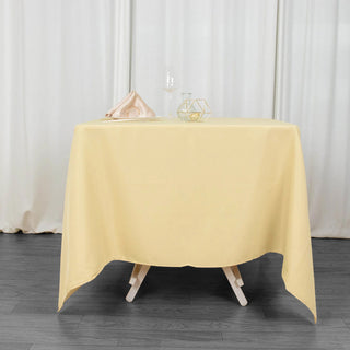 Experience Elegance with the 70"x70" Champagne Premium Seamless Polyester Square Tablecloth