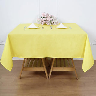 Brighten Up Your Event with the 70"x70" Yellow Square Seamless Polyester Tablecloth