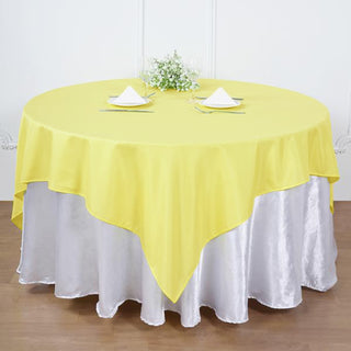 Make a Statement with the 90"x90" Yellow Seamless Square Polyester Table Overlay