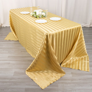 Enhance Your Wedding Decor with the 90"x132" Champagne Satin Stripe Seamless Rectangular Tablecloth